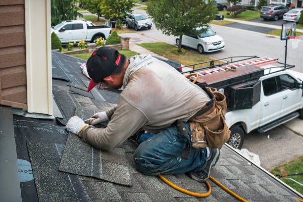 Professional Roofing technician working in East Meadow, NY